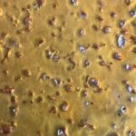 Granddaddy Purple Shatter – Premium cannabis concentrate with a golden, glass-like texture, offering potent effects and a rich grape-berry flavor.