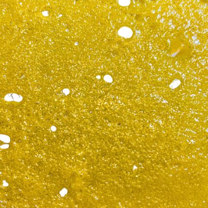 Ice Cream Cake Shatter – Premium cannabis concentrate with a golden, glass-like texture, offering potent effects and a rich creamy-nutty flavor.