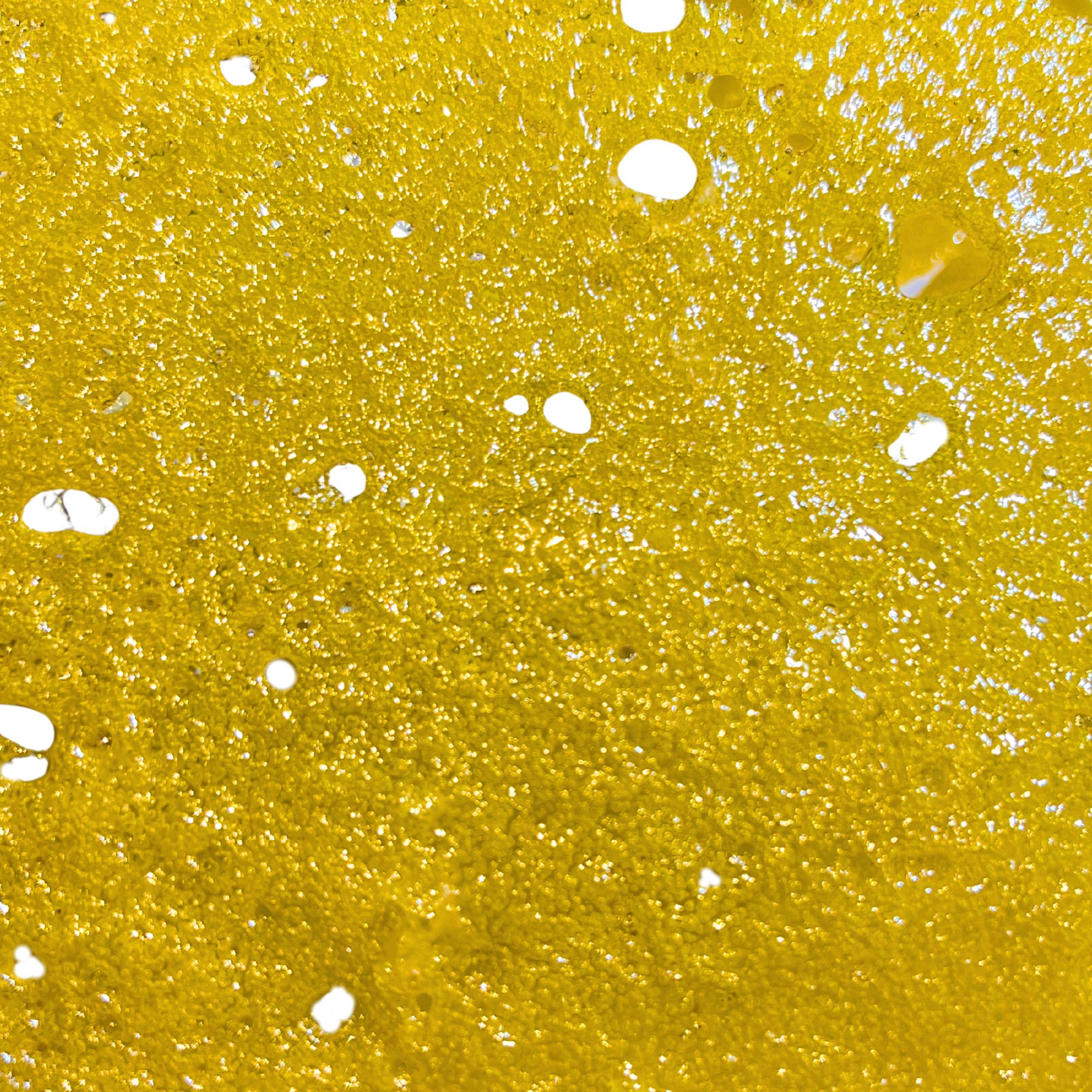 Ice Cream Cake Shatter – Premium cannabis concentrate with a golden, glass-like texture, offering potent effects and a rich creamy-nutty flavor.